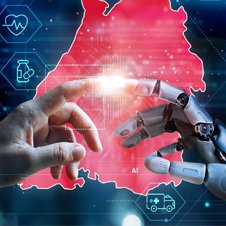 Forum Gesundheitsstandort Baden-Württemberg, Bild zeigt Foto der Kampagne:
der Finger einer menschlichen Hand berührt den Finger einer künstlichen Hand aus Metall